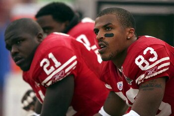 SAN FRANCISCO - DECEMBER 24:  Arnaz Battle #83 and Frank Gore #21 of the San Francisco 49ers sit on the bench against the Arizona Cardinals defends during an NFL game at Monster Park on December 24, 2006 in San Francisco, California.  (Photo by Jed Jacobs
