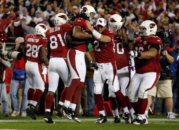 TAMPA, FL - FEBRUARY 01:  Wide receiver Larry Fitzgerald #11 of the Arizona Cardinals celebrates after scoring a 64-yard touchdown reception in the fourth quarter against the Pittsburgh Steelers during Super Bowl XLIII on February 1, 2009 at Raymond James
