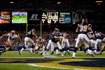 ST. LOUIS, MO - DECEMBER 21:  Marc Bulger #10 of the St. Louis Rams pitches the ball to Steven Jackson #39 during the game against the San Francisco 49ers at the Edward Jones Dome on December 21, 2008 in St. Louis, Missouri. The 49ers won 17-16. (Photo by