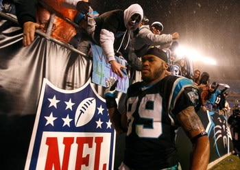 CHARLOTTE, NC - JANUARY 10:  Steve Smith #89 of the Carolina Panthers shakes hands with fans after being defeated 33-13 by the Arizona Cardinals during the NFC Divisional Playoff Game on January 10, 2009 at Bank of America Stadium in Charlotte, North Caro