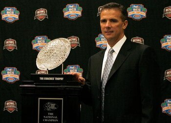 FORT LAUDERDALE, FL - JANUARY 07:  Head coach Urban Meyer of the Florida Gators poses with the 'The Coaches' Trophy' during the FedEx BCS Head Coaches Press Conference at Harbor Beach Marriott Resort & Spa on January 7, 2009 in Fort Lauderdale, Florida.  