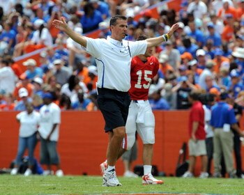 GAINESVILLE, FL - APRIL 18: Coach Urban Meyer of the University of Florida directs the spring football orange and blue game at Ben Hill Griffin Stadium April 18, 2009 in Gainesville, Florida.  (Photo by Al Messerschmidt/Getty Images)
