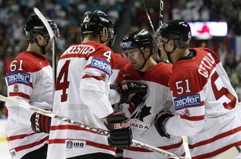 QUEBEC CITY, QC - MAY 18:  Dany Heatley #15 of Canada is congratulated by teammates Ryan Gretzlaf #51, Jay Bouwmeester #4 and Rick Nash #61 after his goal in the second period against Russia during the Gold Medal Game of the International Ice Hockey Feder