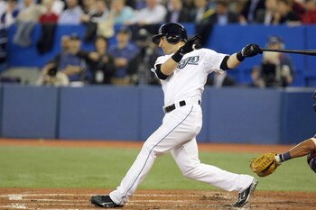 TORONTO - APRIL 6:  Marco Scutaro #19 of the Toronto Blue Jays swings at the pitch during the Opening Day game against the Detroit Tigers at the Rogers Centre on April 6, 2009 in Toronto, Ontario. (Photo by: Dave Sandford/Getty Images)