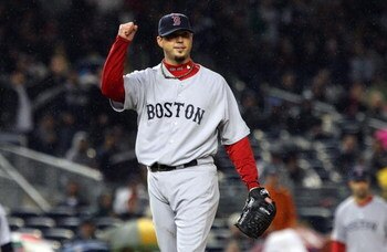 NEW YORK - MAY 05:  Josh Beckett #19 of the Boston Red Sox celebrates the final out of the sixth inning against the New York Yankees on May 5, 2009 at Yankee Stadium in the Bronx borough of New York City. The Red Sox defeated the Yankees 7-3.  (Photo by J