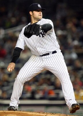 NEW YORK - MAY 05:  Joba Chamberlain #62 of the New York Yankees deals a pitch against the Boston Red Sox on May 5, 2009 at Yankee Stadium in the Bronx borough of New York City. The Red Sox defeated the Yankees 7-3.  (Photo by Jim McIsaac/Getty Images)