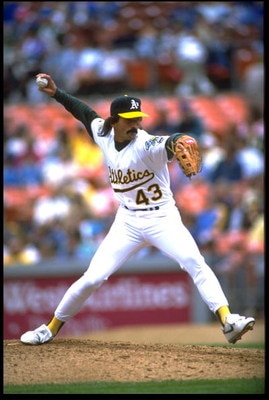 9 APR 1992:  OAKLAND A''S PITCHER DENNIS ECKERSLEY WINDS UP TO PITCH DURING THE A''S VERSUS TEXAS RANGERS GAME AT THE OAKLAND COLISEUM IN OAKLAND, CALIFORNIA.  MANDATORY CREDIT:  KEN LEVINE/ALLSPORT