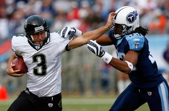 NASHVILLE, TN - NOVEMBER 11:  Adam Podlesh #3 of the Jacksonville Jaguars stiff-arms defensive back Michael Griffin #33 of the Tennessee Titans during a field goal fake in the second half at LP Field on November 11, 2007 in Nashville, Tennessee.  Jacksonv