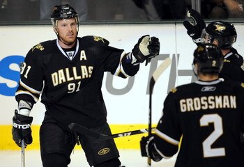 DALLAS - FEBRUARY 03:  Center Brad Richards #91 of the Dallas Stars celebrates his goal with Stephane Robidas #3 and Nicklas Grossman #2 during the third period at the American Airlines Center on February 3, 2009 in Dallas, Texas.  (Photo by Ronald Martin