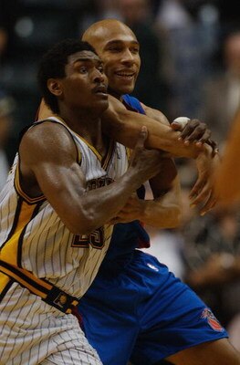 INDIANAPOLIS - MAY 22:  Ron Artest #23 of the Indiana Pacers and Darvin Ham #8 of the Detroit Pistons jostle for position in Game one of the Eastern Conference Finals during the 2004 NBA Playoffs at Conseco Fieldhouse on May 22, 2004 in Indianapolis, Indi