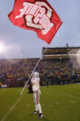 ANN ARBOR, MI - NOVEMBER 24:  Runing back Sam Maldonaldo #5 of the Ohio State Buckeyes waves a school banner after winning the Big Ten Conference football game against the Michigan Wolverines on November 24, 2001 at Michigan Stadium in Ann Arbor, Michigan