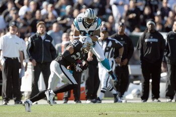 OAKLAND - NOVEMBER 9:  Steve Smith #89 of the Carolina Panthers collides with Nnamdi Asomugha #21of the Oakland Raiders at the Oakland-Alameda County Coliseum on November 9, 2008 in Oakland, California. (Photo by: Jed Jacobsohn/Getty Images)