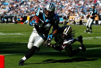 CHARLOTTE, NC - OCTOBER 19:  Running back DeAngelo Williams #34 of the Carolina Panthers rushes in for a touchdown past Mike McKenzie #34 of the New Orleans Saints during the game at Bank of America Stadium on October 19, 2008 in Charlotte, North Carolina