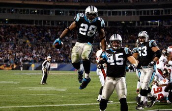 CHARLOTTE, NC - DECEMBER 08:  Jonathan Stewart  #28 of the Carolina Panthers celebrates with teammates after scoring a touchdown against the Tampa Bay Buccaneers at Bank of America Stadium on December 8, 2008 in Charlotte, North Carolina  (Photo by Street
