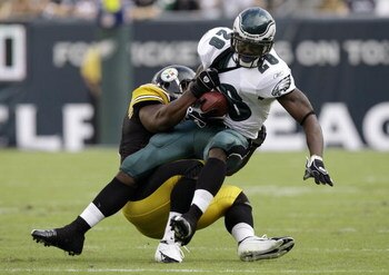 PHILADELPHIA - SEPTEMBER 21: Correll Buckhalter #28 of the Philadelphia Eagles is tackled by James Harrison #92 of the Pittsburgh Steelers during the first half on September 21, 2008 at Lincoln Financial Field in Philadelphia, Pennsylvania. The Eagles won