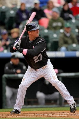 DENVER - MAY 10:  Garrett Atkins #27 of the Colorado Rockies takes an at bat against the Florida Marlins during MLB action at Coors Field on May 10, 2009 in Denver, Colorado. Atkins was one of many players using pink bats in Major League Baseball today as