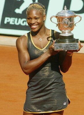 PARIS - JUNE 8: Serena Williams of the USA poses with the winner's cup after winning the French Open against her sister Venus on June 8, 2002 at the Roland Garros stadium in Paris, France. Serena deated Venus 7-5 6-3. (Photo by Pascal Le Segretain/Getty I