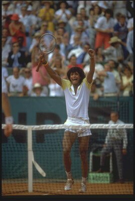 JUN 1983:  YANNICK NOAH OF FRANCE CELEBRATES AFTER WNNING THE MEN's SINGLES TITLE AT THE 1983 FRENCH OPEN GRAND SLAM.