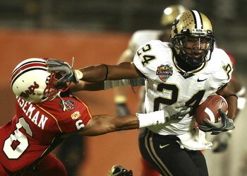 ORLANDO, FL - DECEMBER 29:  Running back Kory Sheets #24 of the Purdue Boilermakers tries to avoid a tackle attempt by cornerback Anthony Wiseman #6 of the Maryland Terrapins in the Champs Sports Bowl at Florida Citrus Bowl December 29, 2006 in Orlando, F