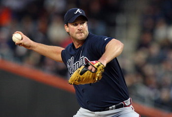 NEW YORK - MAY 11:  Derek Lowe #32 of the Atlanta Braves throws a pitch against the New York Mets on May 11, 2009 at Citi Field in the Flushing neighborhood of the Queens borough of New York City. The Braves defeated the Mets 8-3.  (Photo by Jim McIsaac/G