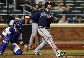NEW YORK - MAY 12:  Brian McCann #16 of the Atlanta Braves bats against the New York Mets on May 12, 2009 at Citi Field in the Flushing neighborhood of the Queens borough of New York City. The Mets defeated the Braves 4-3 in 10 innings.  (Photo by Jim McI