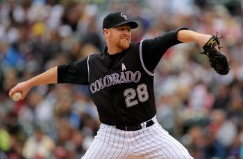 DENVER - MAY 10:  Starting pitcher Aaron Cook #28 of the Colorado Rockies delivers against  the Florida Marlins during MLB action at Coors Field on May 10, 2009 in Denver, Colorado. Cook earned the win as the Rockies defeated the Marlins 3-2.  (Photo by D