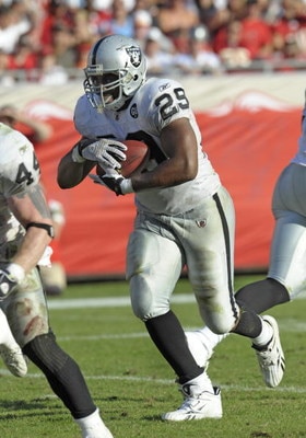 TAMPA, FL - DECEMBER 28: Running back Michael Bush #29 of the Oakland Raiders rushes upfield against the Tampa Bay Buccaneers at Raymond James Stadium on December 28, 2008 in Tampa, Florida.  (Photo by Al Messerschmidt/Getty Images)