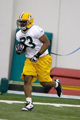GREEN BAY, WI - MAY 1:  Running back Tyrell Sutton #23 runs as he participates in practice drills during Green Bay Packers Minicamp at Don Hutson Center on May 1, 2009 in Green Bay, Wisconsin. (Photo by Scott Boehm/Getty Images)