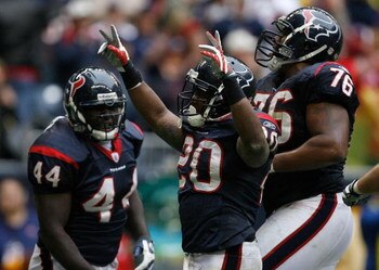 HOUSTON - DECEMBER 28:  Steve Slaton #20 of the the Houston Texans celebrates his touchdown for a 31-17 lead with teammates Duane Brown #76 and Vonta Leach #44 against the Chicago Bears during the second half at the Reliant Stadium December 28, 2008 in Ho