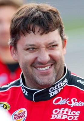 CONCORD, NC - MAY 21: Tony Stewart, driver of the #14 Office Depot Chevrolet, smiles during qualifying for the NASCAR Sprint Cup Series Coca-Cola 600 on May 21, 2009 at Lowe's Motor Speedway in Concord, North Carolina.  (Photo by Geoff Burke/Getty Images 