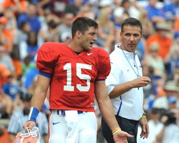 GAINESVILLE, FL - APRIL 18: Quarterback Tim Tebow #15 of the University of Florida talks with coach Urban Meyer during the spring football Orange and Blue game April 18, 2009 at Ben Hill Griffin Stadium in Gainesville, Florida.  (Photo by Al Messerschmidt