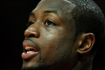 MIAMI - APRIL 25:  Dwyane Wade #3 of the Miami Heat cheers his team on from the bench in the fourth quarter against the Atlanta Hawks during Game Three of the Eastern Conference Quarterfinals at American Airlines Arena on April 25, 2009 in Miami, Florida.