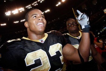 NEW ORLEANS - DECEMBER 07:  Pierre Thomas #23 and Reggie Bush #25 of the New Orleans Saints celebrate after defeating the Atlanta Falcons 29-25 on December 7, 2008 at the Superdome in New Orleans, Louisiana.  (Photo by Chris Graythen/Getty Images)