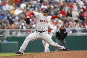 KANSAS CITY, MO - APRIL 5:  Pitcher J.C. Romero #32 of the Boston Red Sox throws a pitch against the Kansas City Royals on April 5, 2007 at Kauffman Stadium in Kansas City, Missouri.  Boston defeated the Royals 4-1. (Photo by G. Newman Lowrance/Getty Imag