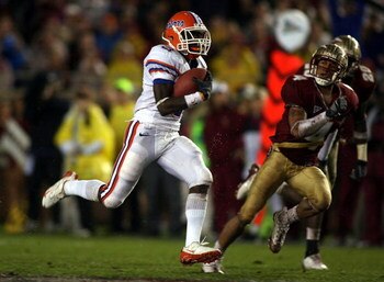 TALLAHASSEE, FL - NOVEMBER 29:  Running back Chris Rainey #3 of the Florida Gators runs the ball against cornerback Tony Carter #4 of the Florida State Seminoles at Bobby Bowden Field at Doak Campbell Stadium on November 29, 2008 in Tallahassee, Florida. 