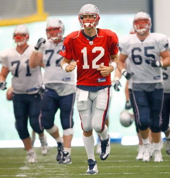 FOXBORO, MA - JULY 24:  Tom Brady #12 of the New England Patriots participates in a drill during the first day of training camp at Gillette Stadium on July 24, 2008 in Foxboro, Massachusetts.  (Photo by Jim Rogash/Getty Images)