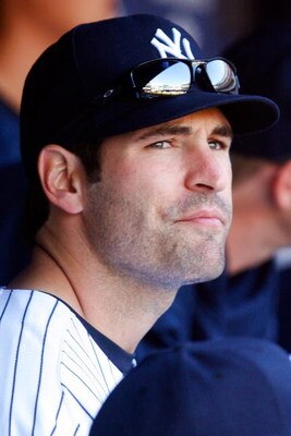 NEW YORK - APRIL 16:  Xavier Nady #22 of the New York Yankees looks on from the dugout during the opening day game against the Cleveland Indians during opening day at the new Yankee Stadium on April 16, 2009 in the Bronx borough of New York City. This is 