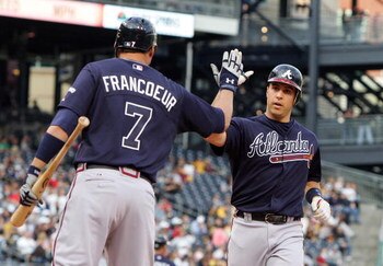 PITTSBURGH - MAY 10:  Mark Teixeria #24 of the Atlanta Braves is congratulated by teammate Jeff Francoeur #7 after his first inning two run home run againstof the Pittsburgh Pirates on May 10, 2008 at PNC Park in Pittsburgh, Pennsylvania.  (Photo by Jim M