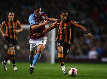 BIRMINGHAM, ENGLAND - MAY 04:  Gareth Barry of Aston Villa battles for the ball with Geovanni of Hull City during the Barclays Premier League match between Aston Villa and Hull City at Villa Park on May 4, 2009 in Birmingham, England. (Photo by Jamie McDo
