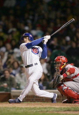 CHICAGO - SEPTEMBER 15:  Ryan Theriot #55 of the Chicago Cubs swings at the pitch during a game against the St. Louis Cardinals on September 15, 2005 at Wrigley Field in Chicago, Illinois. The Cardinals won 6-1. (Photo by Jonathan Daniel/Getty Images)