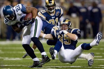 ST. LOUIS, MO - DECEMBER 14:  Todd Johnson #35 of the St. Louis Rams tackles Julius Jones #22 of the Seattle Seahawks at the Edward Jones Dome on December 14, 2008 in St. Louis, Missouri.  (Photo by Dilip Vishwanat/Getty Images)