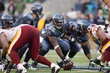 SEATTLE - NOVEMBER 23:  Center Chris Spencer #65 of the Seattle Seahawks gets ready to hike the ball during the game against the Washington Redskins on November 23, 2008 at Qwest Field in Seattle, Washington. (Photo by Otto Greule Jr/Getty Images)