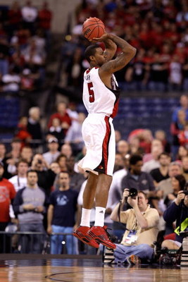 INDIANAPOLIS - MARCH 27: Earl Clark #5 of the Louisville Cardinals attempts a shot against the Arizona Wildcats during the third round of the NCAA Division I Men's Basketball Tournament at the Lucas Oil Stadium on March 27, 2009 in Indianapolis, Indiana.