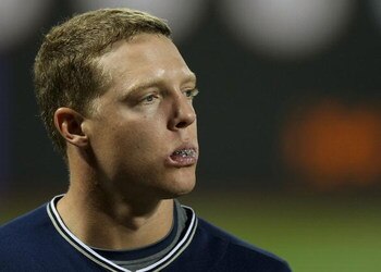 FLUSHING, NY - APRIL 13:  Nick Hundley #4 of the San Diego Padres looks on from the dugout against the New York Mets during opening day at Citi Field on April 13, 2009 in the Flushing neighborhood of the Queens borough of New York City. This is the first 