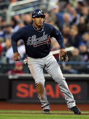 NEW YORK - MAY 11:  Yunel Escobar #19 of the Atlanta Braves leads off first base against the New York Mets on May 11, 2009 at Citi Field in the Flushing neighborhood of the Queens borough of New York City. The Braves defeated the Mets 8-3.  (Photo by Jim 