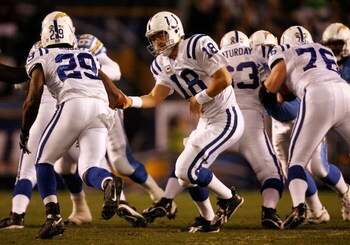 SAN DIEGO - JANUARY 03:  Quarterback Peyton Manning hands the ball off to running back Joseph Addai #29 of the Indianapolis Colts against the San Diego Chargers during their AFC Wild Card Game on January 3, 2009 at Qualcomm Stadium in San Diego, Californi