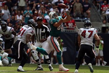 HOUSTON - OCTOBER 12:  Tight end Anthony Fasano #80 of the Miami Dolphins drops a pass against the Houston Texans at Reliant Stadium on October 12, 2008 in Houston, Texas.  (Photo by Ronald Martinez/Getty Images)