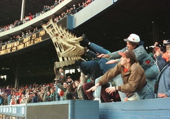 17 Dec 1995: CLEVELAND BROWNS FANS, ANGRY AT THE DECISION TO MOVE THE TEAM TO BALTIMORE, THROW A ROW OF SEATS ONTO THE FIELD AFTER THE BROWNS'' 26-10 VICTORY OVER THE CINCINNATI BENGALS AT CLEVELAND STADIUM IN CLEVELAND, OHIO. THE GAME COULD BE THE LAST E
