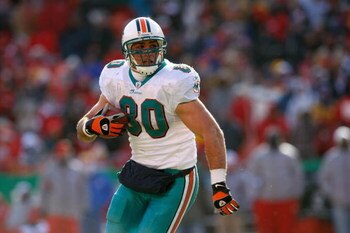 KANSAS CITY, MO - DECEMBER 21:  Anthony Fasano #80 of the Miami Dolphins carries the ball during the game against the Kansas City Chiefs on December 21, 2008 at Arrowhead Stadium in Kansas City, Missouri. (Photo by Jamie Squire/Getty Images)