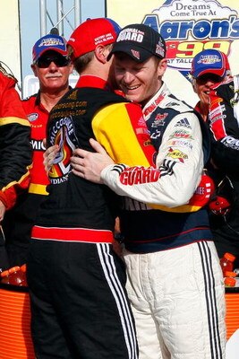 TALLADEGA, AL - APRIL 26:  Dale Earnhardt Jr. (R), driver of the #88 National Guard/Amp Energy Chevrolet, congratulates Brad Keselowski (L), driver of the #09 Miccosukee Chevrolet, in victory lane after winning the NASCAR Sprint Cup Series Aaron's 499 at 